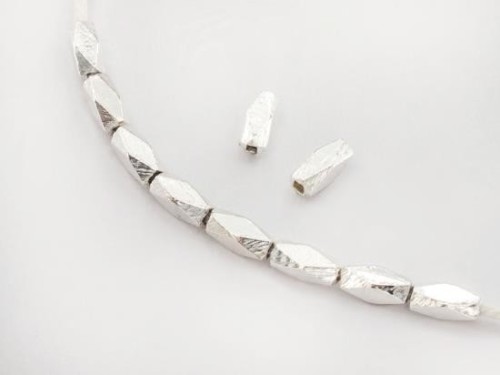 10 of Karen Hill Tribe Silver Faceted Oval Beads 3x7mm.