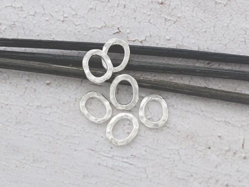 6 of Karen Hill Tribe Silver Hammered Oval Closed Jump Rings 8.5x10.8 mm.