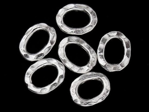 8 of Karen Hill Tribe Silver Hammer Oval Closed Jump Rings 6.5x9 mm.