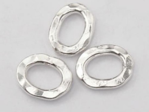 8 of Karen Hill Tribe Silver Hammer Oval Closed Jump Rings 6.5x9 mm.