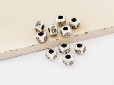 Karen Hill Tribe Silver Ohm Imprint Beads 6x4.3 mm.