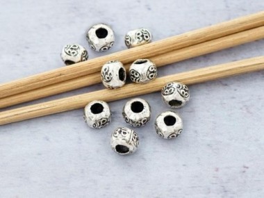 Karen Hill Tribe Silver Ohm Imprint Beads 6x4.3 mm.