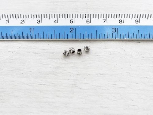 35 of Karen Hill Tribe Silver Imprinted Spacer Beads 3x3.2mm. 4 inches