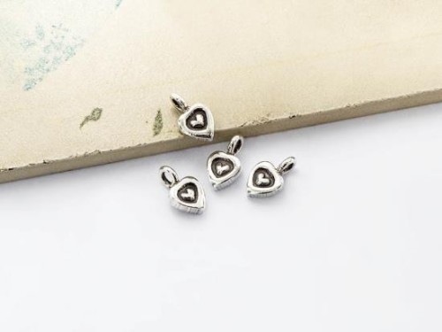 4 of Karen Hill Tribe Silver Imprinted Heart Charms 7x6 mm.