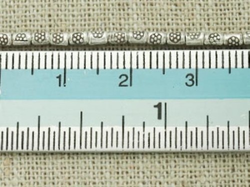 60 of Karen Hill Tribe Silver Daisy Printed Spacer Beads 2.2 x 3.2 mm.