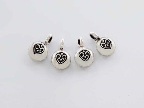 4 of Karen Hill Tribe Silver Heart Imprint Charms 7.5 mm.