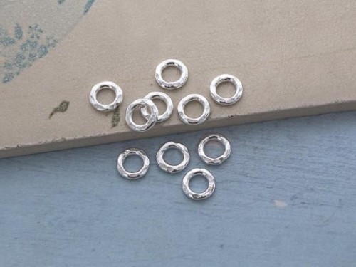 10 of Karen Hill Tribe Silver Hammer Closed Jump Rings 7mm.