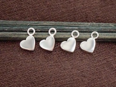 4 of 925 Sterling Silver Heart Charms 5x6mm. Polish Finished .