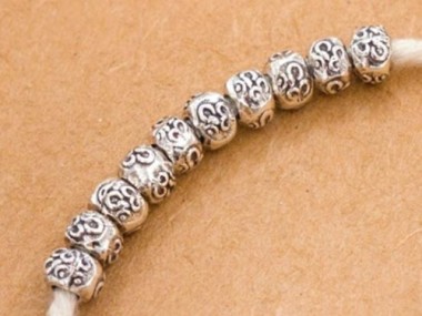 Karen Hill Tribe Silver Ohm Imprinted Beads 5x4 mm.