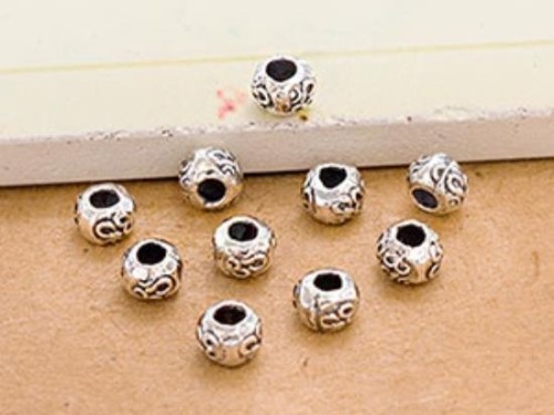 20 of Karen Hill Tribe Silver Ohm Imprinted Beads 5x4 mm.