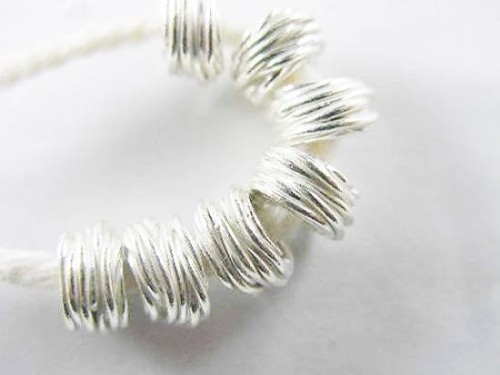 8 of Karen Hill Tribe Silver Wire Drum Beads 6x4 mm.