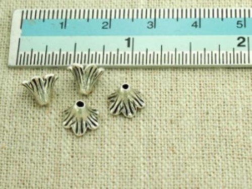 8 of Karen Hill Tribe Silver Flower Bead Caps 5x8 mm.