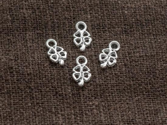 4 of 925 Sterling Silver Tiny Four Leaf Clover Charms 4x6 mm.