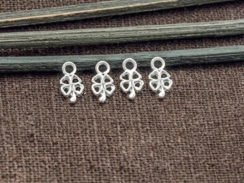 4 of 925 Sterling Silver Tiny Four Leaf Clover Charms 4x6 mm.