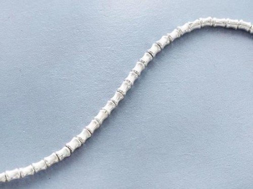 70 of Karen Hill Tribe Silver Hourglass Beads 2.5x3.5 mm. 9"