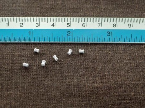 70 of Karen Hill Tribe Silver Hourglass Beads 2.5x3.5 mm. 9"