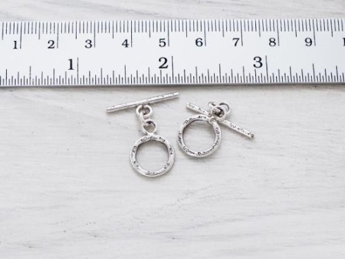 2 of Karen Hill Tribe Silver Daisy Imprint Toggles 12 mm.