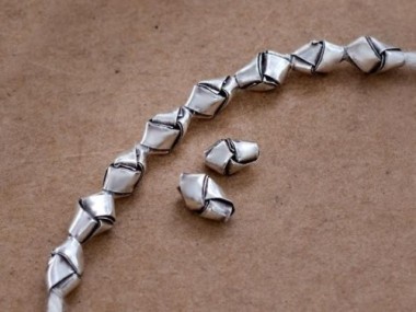 10 of Karen Hill Tribe Silver Woven Beads 5x9mm., lightly Oxidized.