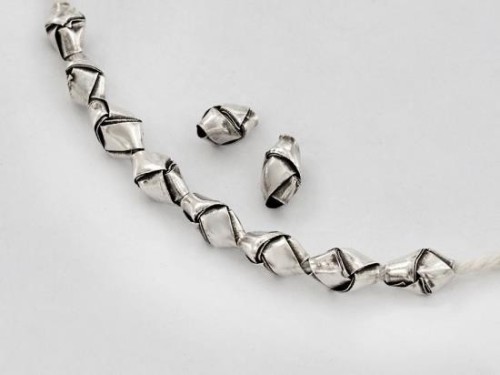 10 of Karen Hill Tribe Silver Woven Beads 5x9mm., lightly Oxidized.